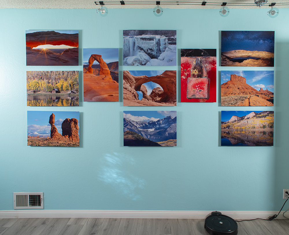 A wall display of John A. Vink images.