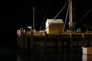 A dock at Morrow Bay, California at night