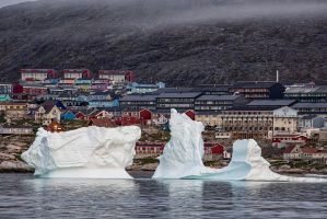 Iceberg floating in front of the village of Ilulisatt in Greenland