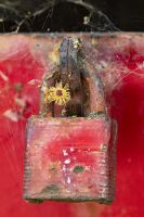 A red lock on a red toolbox